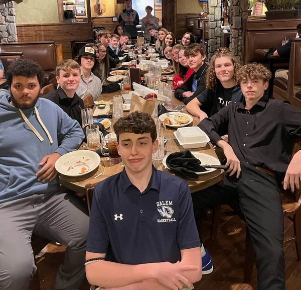 Highschool boys basketball team at dinner